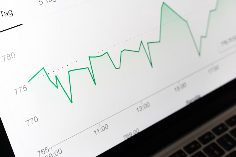 Laptop open on a desk showing financial data